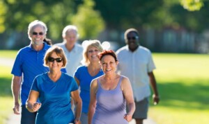 Group of seniors walking together outside.