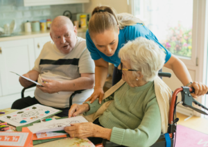 Caregiver supporting a senior with long-term care needs at home.